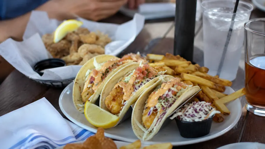 Fish tacos and fries on an outdoor restaurant table at the New Jersey Shore.
